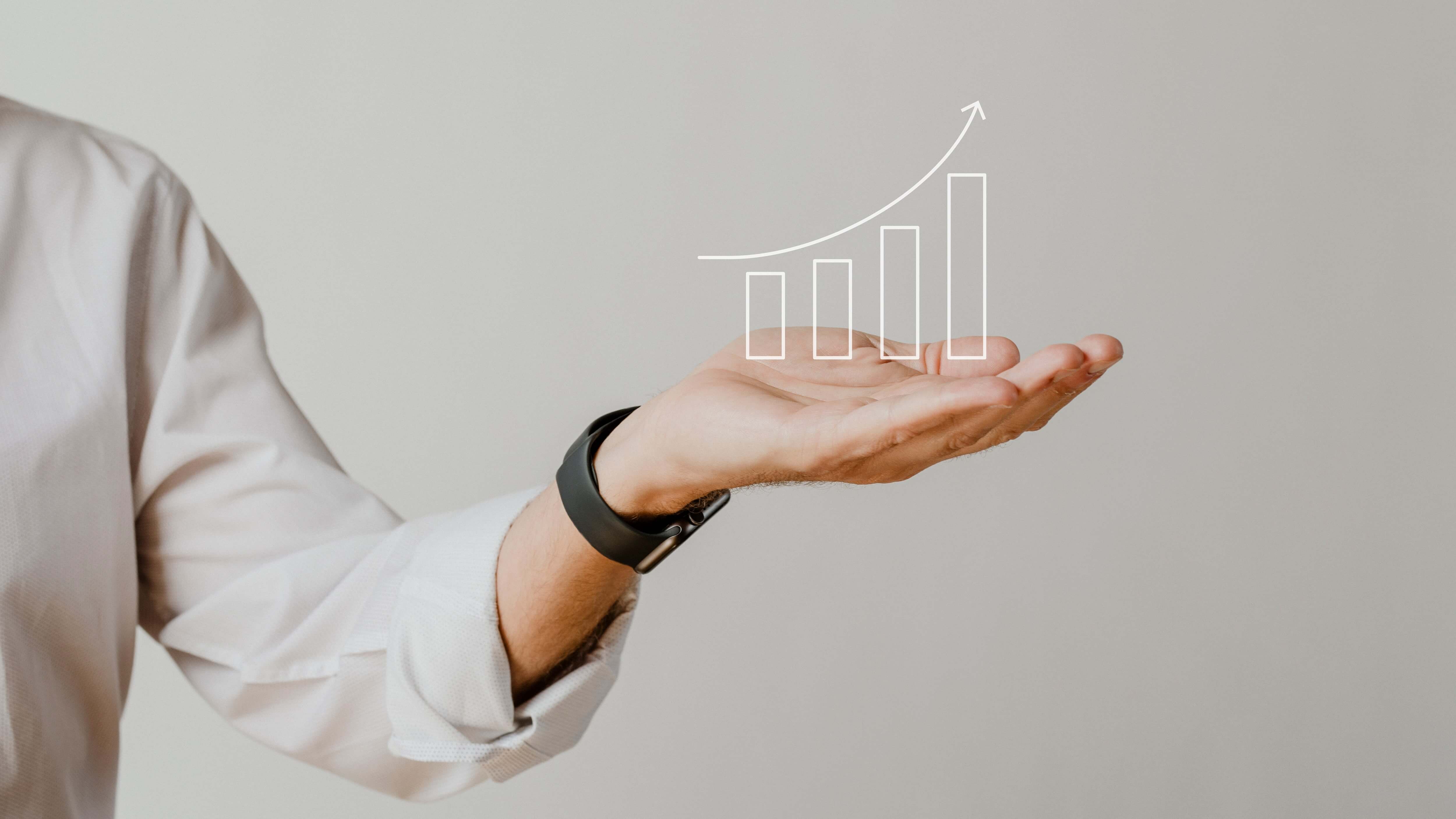 Партнерские программы онлайн-кинотеатров digital increasing bar graph with businessman hand overlay min - Партнерские программы онлайн-кинотеатров