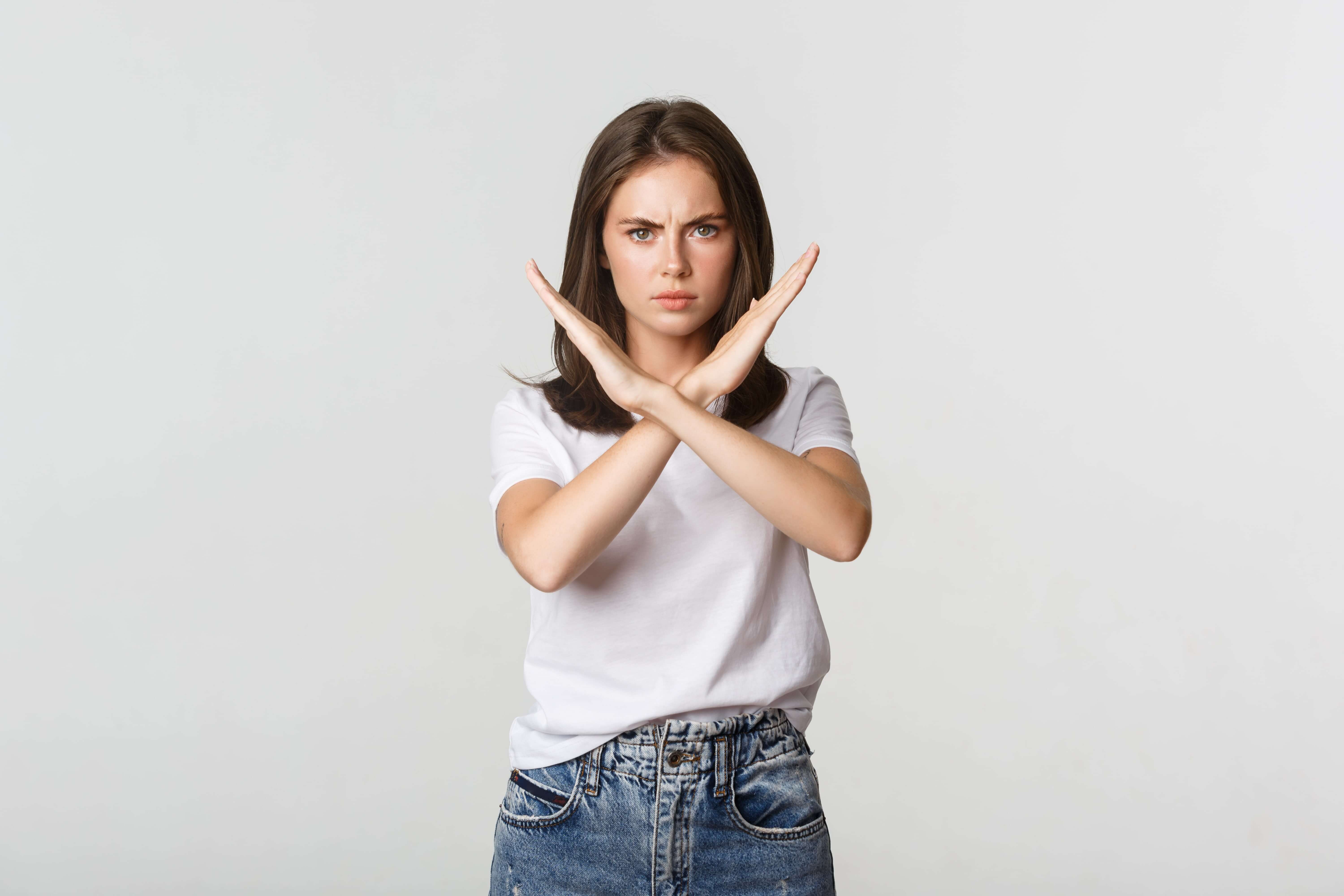 serious angry woman showing cross stop something bad express disapproval dislike min - Что такое холд в партнерской программе?